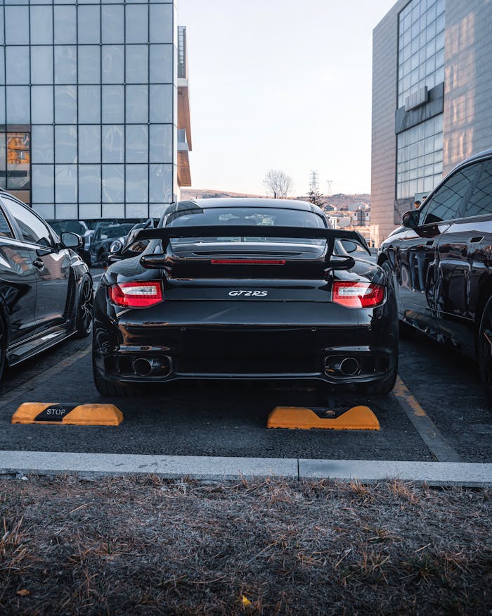 Rear view of a black GT2 RS car parked in Ankara city area.